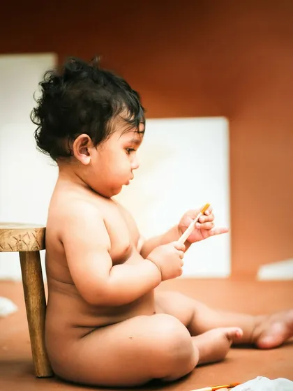 Contemplating his next masterpiece. The warm, earthy tones of this artist-themed shoot create a beautiful and unique portrait.