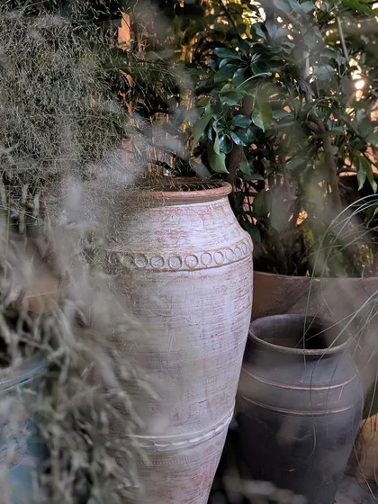 A close-up from the Anita Dongre 'Vaana' collection preview. We used large, antique-style terracotta urns and filled them with soft, feathery grasses to create a dreamy, rustic texture that perfectly matched the event's enchanting forest theme.