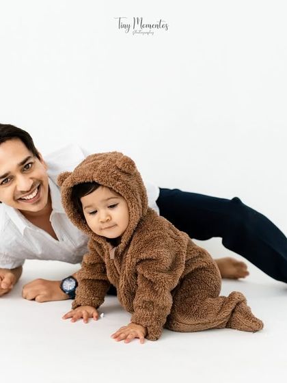 A playful moment on the floor. I love capturing the fun and games that happen naturally during a family session.