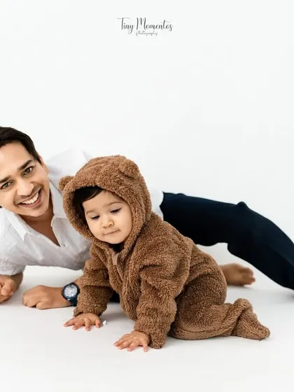 A playful moment on the floor. I love capturing the fun and games that happen naturally during a family session.