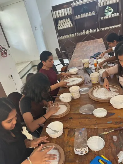 A daytime view of our 3-D Moon workshop for school students. Participants are applying texture paste to their moon bases, the first step in creating their unique lamps.