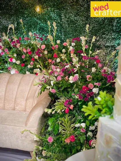 A close-up detail of the floral arrangement from the Calicut wedding, showing the rich mix of colorful flowers and fresh greenery.