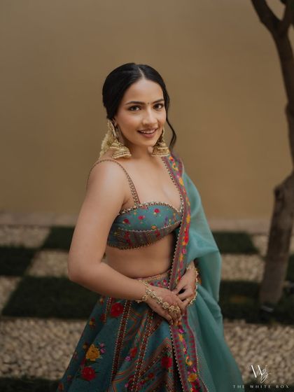 Shubhangi looking fresh and happy, ready for her Haldi function. The makeup is light, breathable, and perfect for a day event.