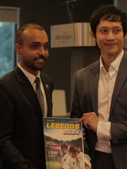 Seek respect, not attention. Our chief instructor presenting our academy's magazine during an international event in Malaysia.