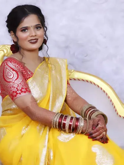 A seated portrait of the bride, looking graceful and poised.