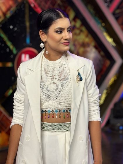 A chic, modern look in a white pantsuit for a 'Jodi No. 1' episode. This demonstrates my stylistic versatility, from traditional to contemporary fashion.