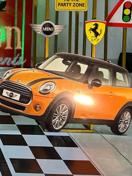 A Mini Cooper cutout prop, another great addition to a car-themed party.