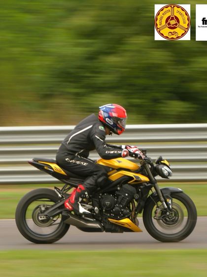 A yellow Triumph Street Triple adding a splash of color to the track. We love seeing a diverse lineup of motorcycles at our events.