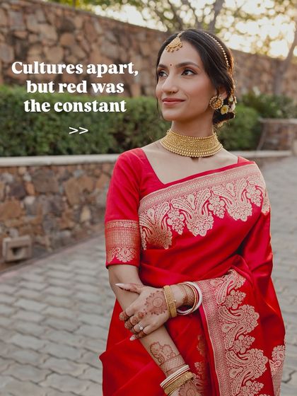 This image shows a beautiful bride in a classic red saree, proving that this timeless color is a constant across cultures and ceremonies.