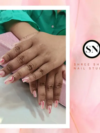 A beautiful example of brush art with these elegant pink and white swirls on a nude base.