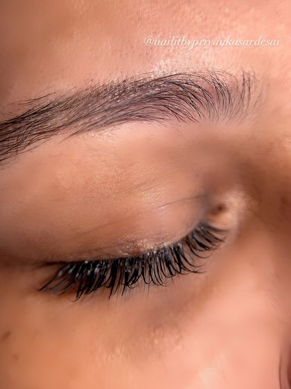 A detailed shot of a finished Classic lash set. You can see the clean application and how each extension is individually bonded, ensuring they feel lightweight and look completely natural.