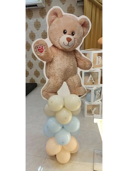 A cute teddy bear cutout on a balloon pillar, a perfect standalone decoration or addition to a larger theme.