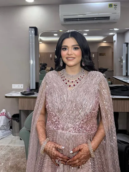 The full look, showing the elegant gown and the perfectly coordinated soft glam makeup.