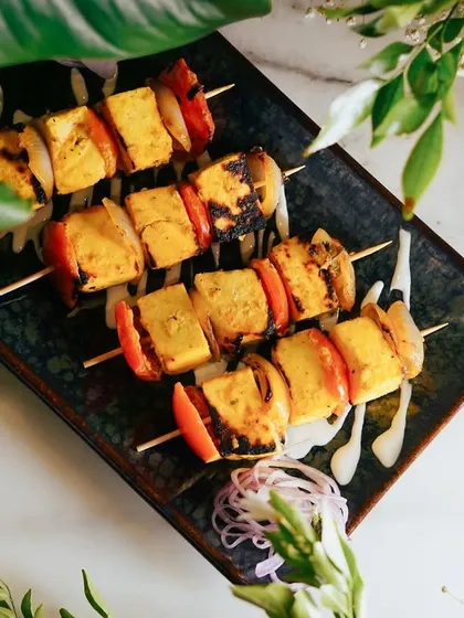 My vegetarian offerings are crafted with the same passion and attention to detail. These Saffron Paneer Skewers feature soft paneer marinated in fragrant saffron and spices, grilled with fresh vegetables. It's a popular choice for guests who prefer a delicious vegetarian starter.