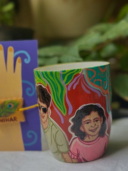 A custom portrait mug and a peacock feather Rakhi, a beautiful and thoughtful gift set.
