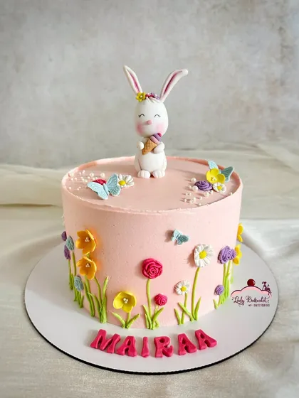 I designed this adorable Easter cake for a little one named Mairaa. The buttercream cake is decorated with hand-piped wildflowers, and the cute bunny topper holding an ice cream cone adds a playful touch.
