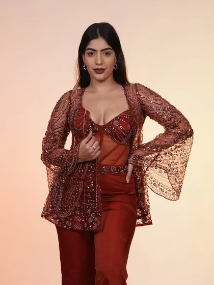 This rust-colored corset and jacket set is for when you want to skip the traditional and go straight for the kill. It’s the perfect fusion look for a sangeet or cocktail party.