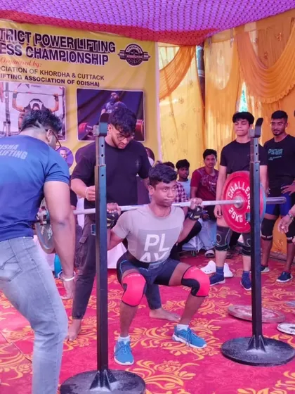 A young lifter showing great form at a district championship. We build our athletes from the junior ranks up.
