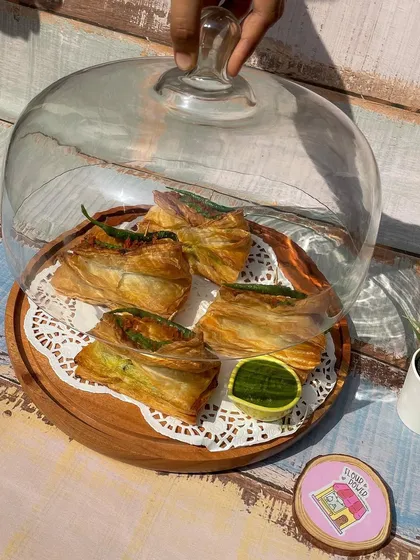 My vada pav puffs served under a glass cloche, ready for a party. They make a great and unique appetizer.