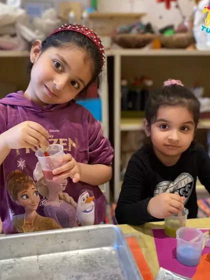 Two sisters working together on a science experiment. It’s a great way for siblings to collaborate and learn from each other in a fun setting.