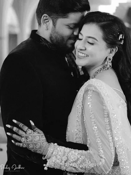 A beautiful, joyful smile from the bride-to-be. This black and white close-up of Swati and Sarthak captures a moment of pure happiness and intimacy during their engagement.