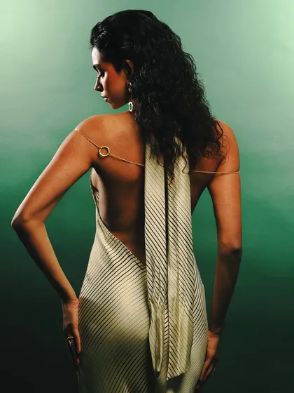 A view of the backless dress and delicate body chain from the Batoki Art lookbook. This shot emphasizes how the jewelry can be styled with elegant eveningwear.