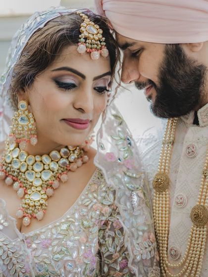 A beautiful and intimate portrait of a Sikh couple. The soft lighting and their gentle expressions make this a truly romantic image.