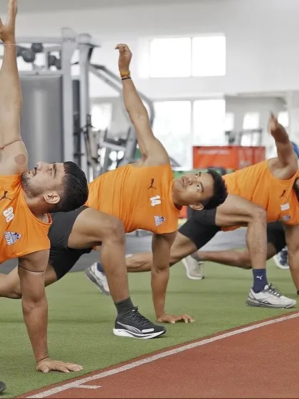 A synchronized mobility drill. The entire team moving as one, focusing on thoracic rotation to improve flexibility and prevent injuries.