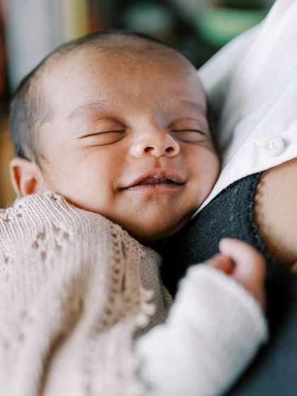 The sweetest newborn smile. Capturing these fleeting sleepy smiles is one of the magical parts of a newborn session.