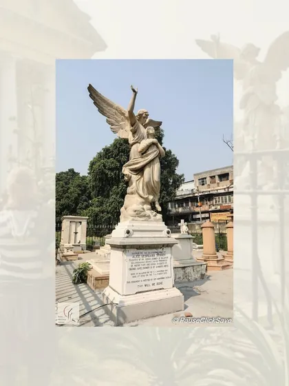 An angelic statue in the graveyard of St. James' Church. The churchyard contains the graves of many prominent figures from the colonial period, including William Fraser and Thomas Metcalfe.