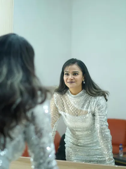 A final check in the mirror. Ready to own the stage.