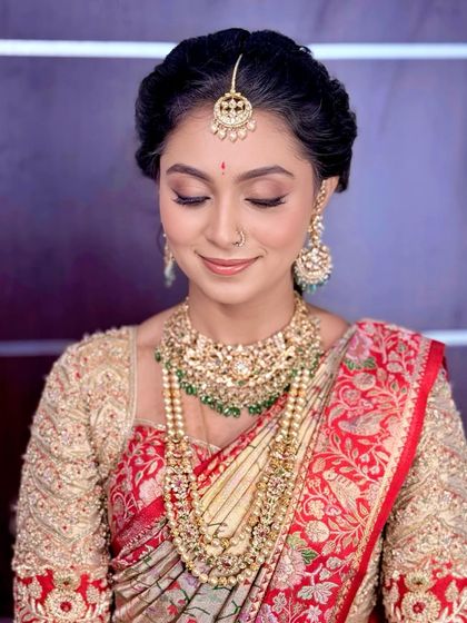 Eyes closed, this shot provides a clear view of the soft, blended eyeshadow and perfectly defined eyeliner.