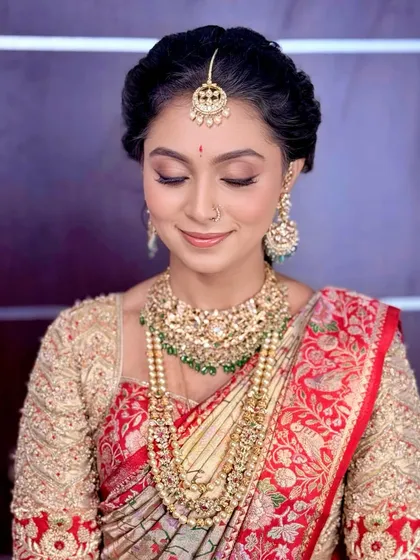 Eyes closed, this shot provides a clear view of the soft, blended eyeshadow and perfectly defined eyeliner.