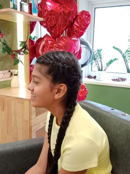 A fun and stylish braided hairstyle for a teen. This look is perfect for keeping hair neat while still being trendy.