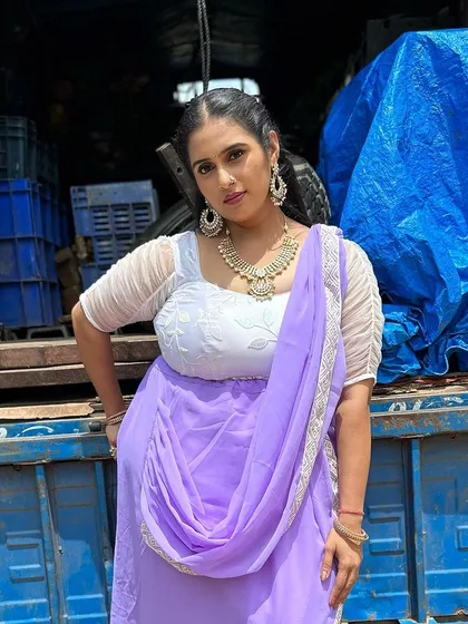 I had the pleasure of designing this lavender outfit for the movie 'Ravike Prasanga'. It’s an Indo-Western half saree style, with a modern draped skirt and a white embroidered blouse with sheer, ruffled sleeves.