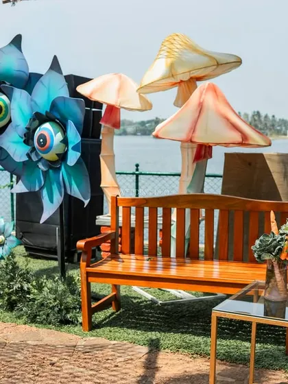 A face painting station for our "Wilderness Lake Festival" themed Mehendi. The setup included our quirky, googly-eyed flower art, adding to the fun and interactive nature of the event.