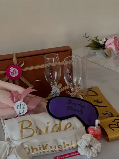 This bride-to-be hamper is all about the fun. It includes a "Bride" sash, personalized champagne glasses for toasting, a "Sleeping Beauty" eye mask, and other cute essentials for the pre-wedding celebrations.