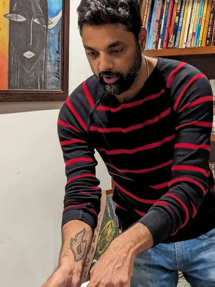 A focused shot of me performing a card trick. The details and sleight of hand are what make the magic happen.