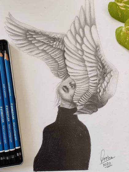 A surrealist graphite portrait of a woman with large angel wings covering her head. This piece combines realism with imagination.