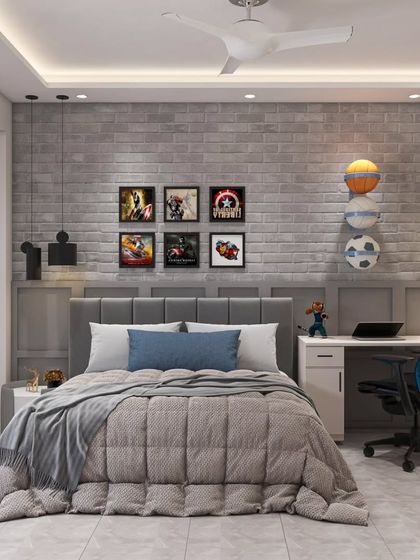 A fun and functional kids' room. The exposed brick-style wallpaper, superhero-themed artwork, and a dedicated study corner create a space that is perfect for a growing child to play, study, and dream.