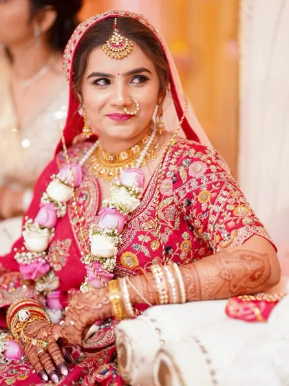 A candid moment during the ceremony. Her soft glam makeup ensures she looks fresh and beautiful throughout the long day.