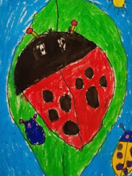 This preschooler's artwork shows great progress in controlling their coloring and staying within the lines, a key fine motor skill we develop.