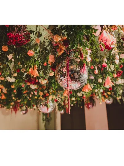 A duplicate of 358, focusing on the unique combination of rustic florals and glam disco balls.