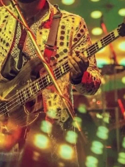 A close-up on the intricate guitar work during a high-energy performance.