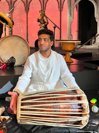 Performing on the Pakhavaj as part of a percussion ensemble for the India Couture Week fashion show.