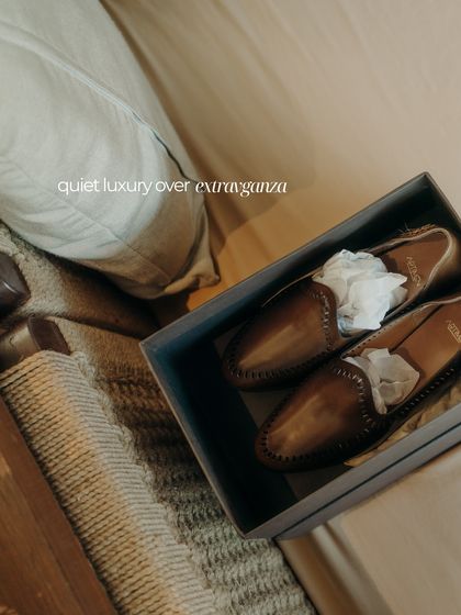 Quiet luxury over extravagance. For the groom who values subtle sartorial choices, we focus on quality craftsmanship, like these perfectly finished leather shoes.