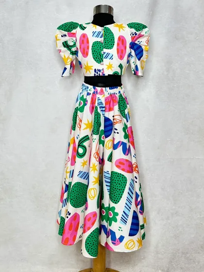 For a quirky and fun festive look. This "Fun Shapes" lehenga features a playful abstract print and puff sleeves, offering a modern and artistic take on traditional wear.