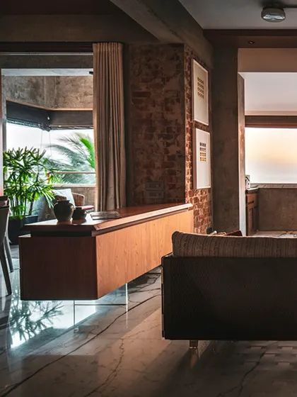A floating wooden console in 'The Canvas' apartment. The design uses clever details like this to create a sense of lightness and space, even while using solid, honest materials.