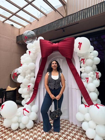 A full-length view of my look with the straight hair extensions. It's a completely different vibe, and it shows my audience how they can experiment with their style without committing to a permanent change.