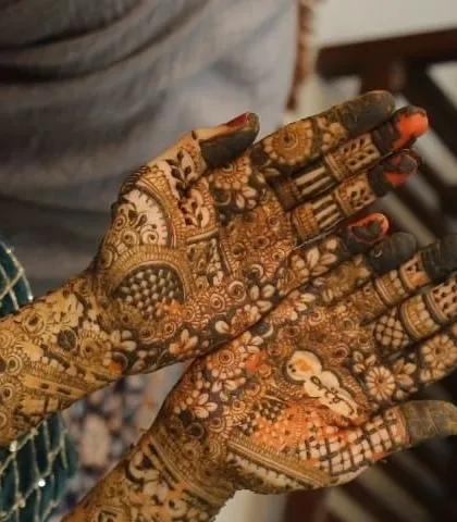 A close-up of a detailed palm design with the paste just starting to dry. This kind of intricate work is perfect for anyone wanting beautiful henna for a special event.